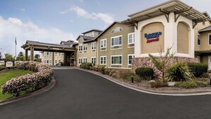 A multi-story building with a sign for Fairfield Inn & Suites by Marriott.