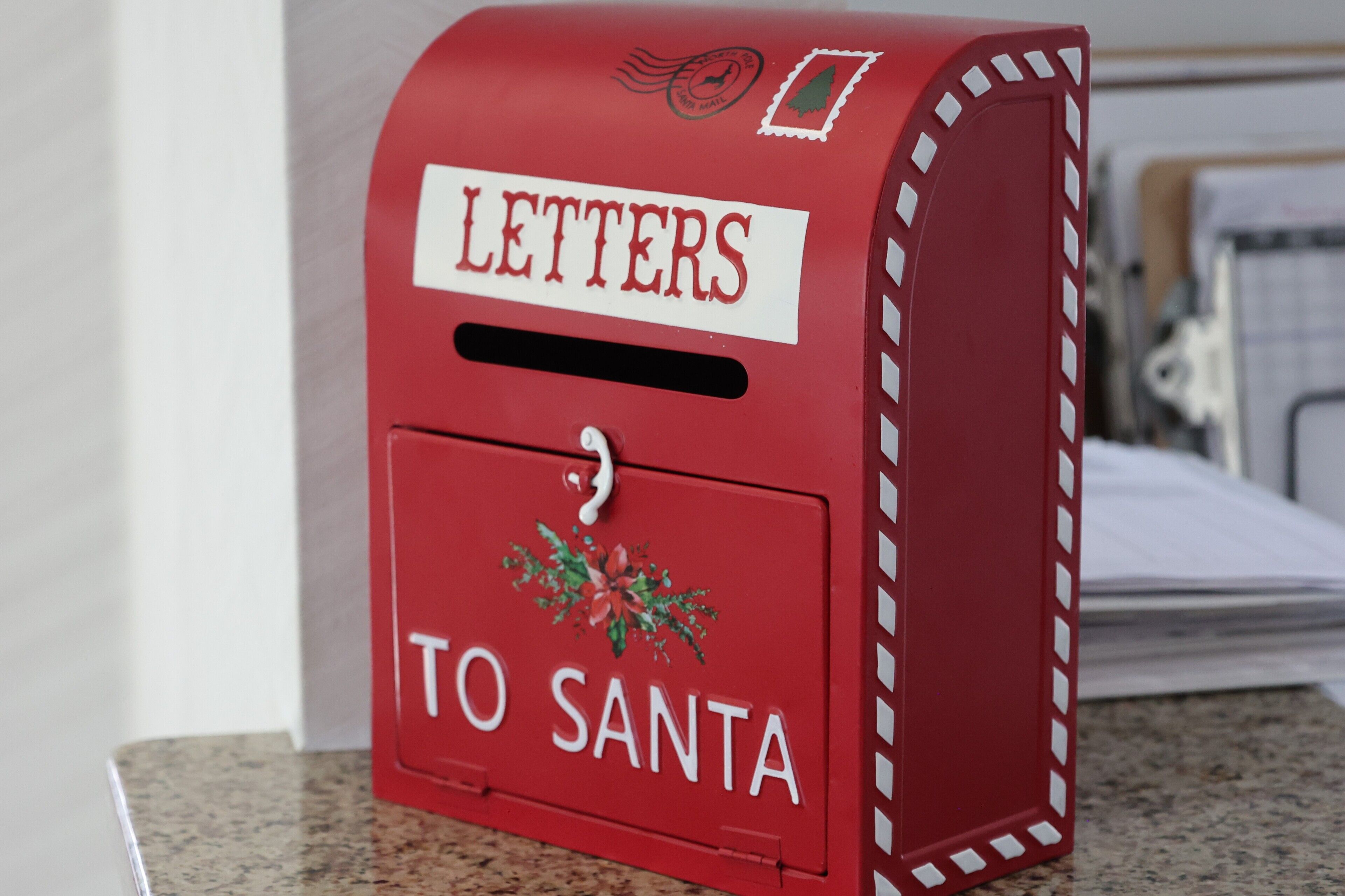 A red mailbox with "LETTERS TO SANTA" written on it.