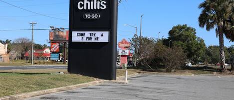 A parking lot with a sign for Chili's restaurant.