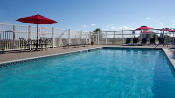 Seasonal outdoor pool, open 9 AM to 9 PM, pool umbrellas, pool loungers
