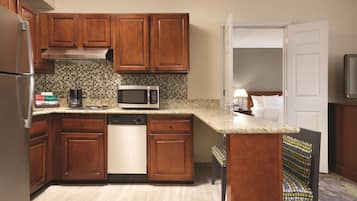 Full-size fridge, microwave, stovetop, coffee/tea maker