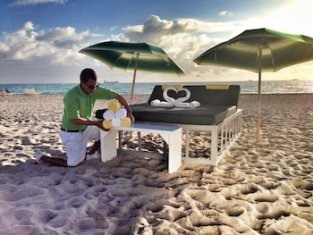 Beach nearby, white sand, sun loungers, beach towels at Crest Hotel Suites