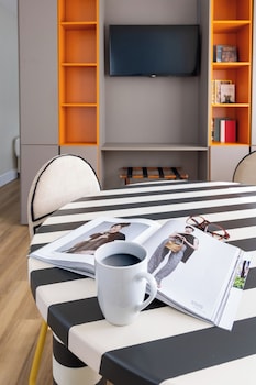 Studio, 2 Double Beds, Kitchenette | Living area | LCD TV at Crest Hotel Suites