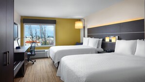 A hotel room with two beds, a desk, a chair, and a large window offering a city view. - Holiday Inn Express Suites Belmont by IHG (Belmont)