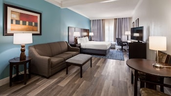 Desk, laptop workspace, blackout drapes, iron/ironing board at Best Western Plus Ambassador Suites Venice