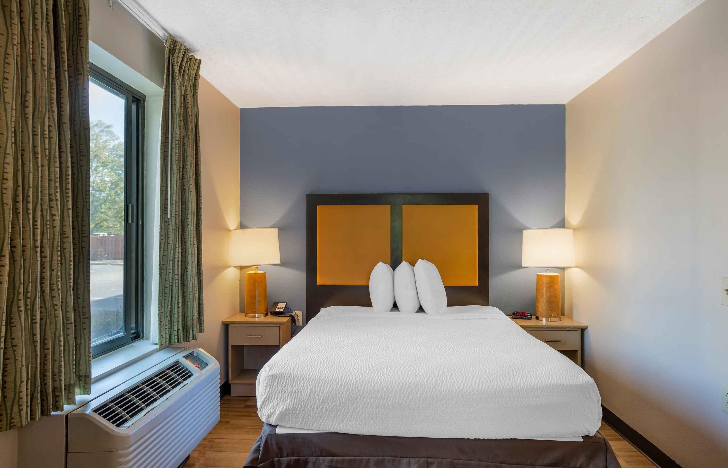 desk, laptop workspace, blackout curtains, iron/ironing board