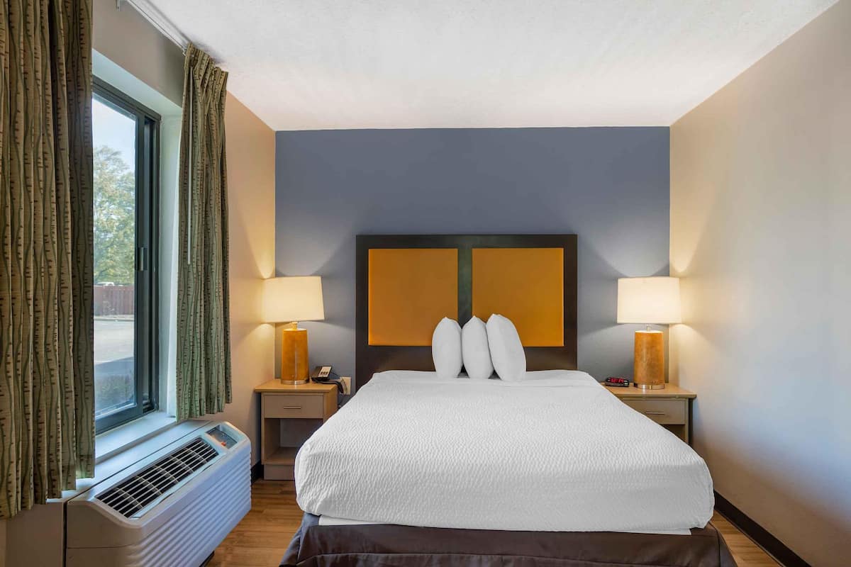 desk, laptop workspace, blackout curtains, iron/ironing board