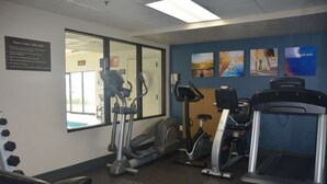 A fitness center with treadmills, elliptical machines, and a wall with motivational posters. - Comfort Inn & Suites Maumee - Toledo (I80-90) (Maumee)