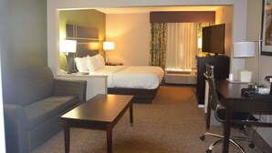 A hotel room with a bed, a sofa, a desk, and a TV. - Comfort Inn & Suites Maumee - Toledo (I80-90) (Maumee)