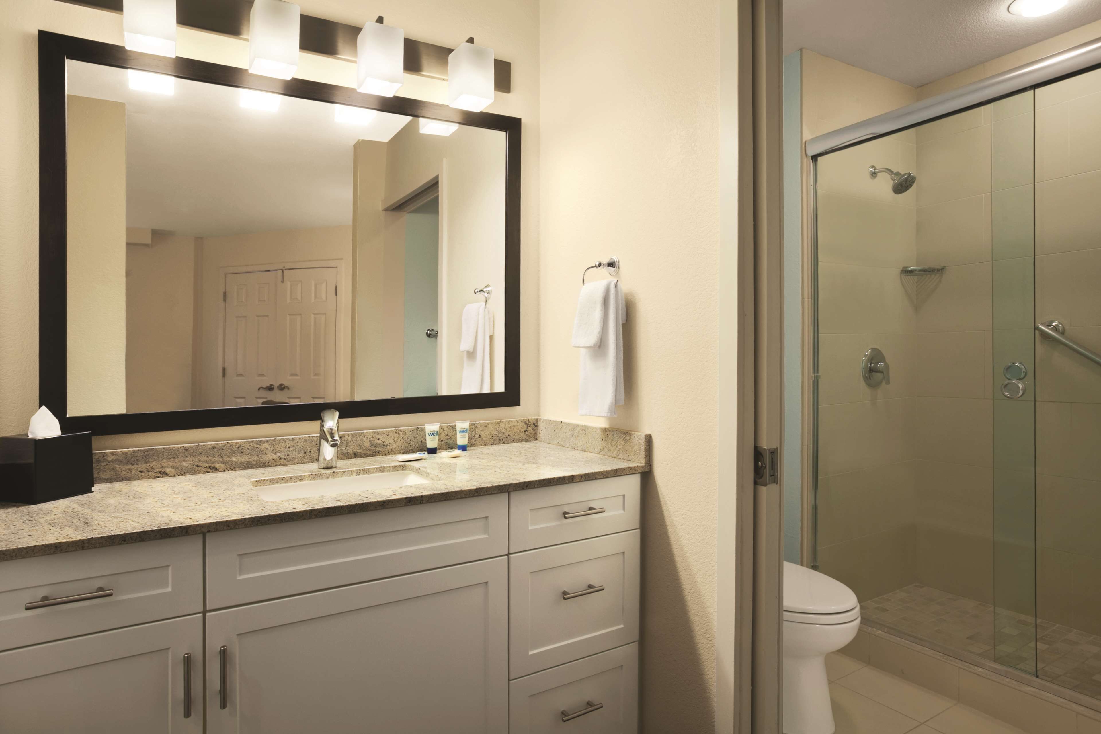 designer toiletries, hair dryer, towels