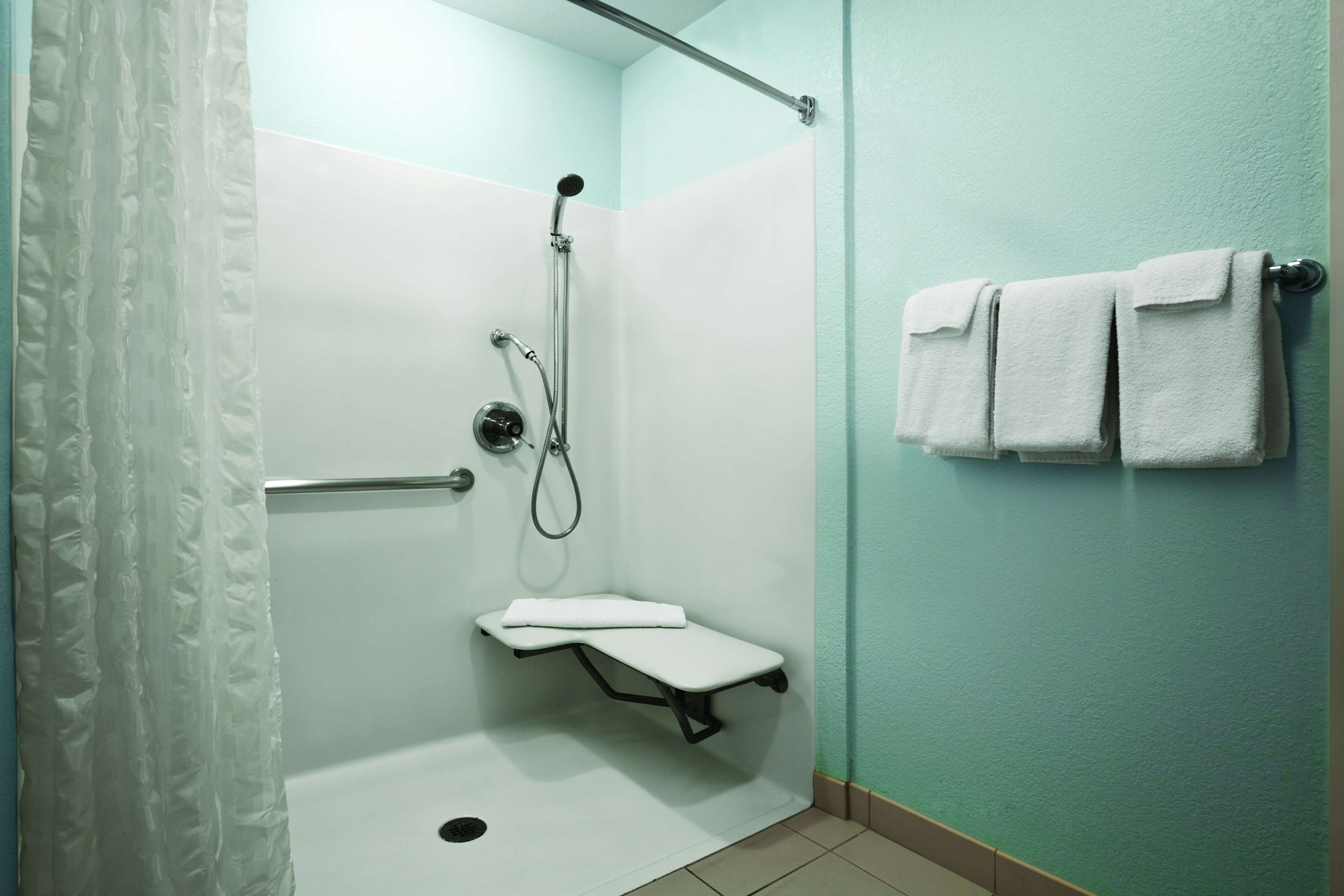 designer toiletries, hair dryer, towels