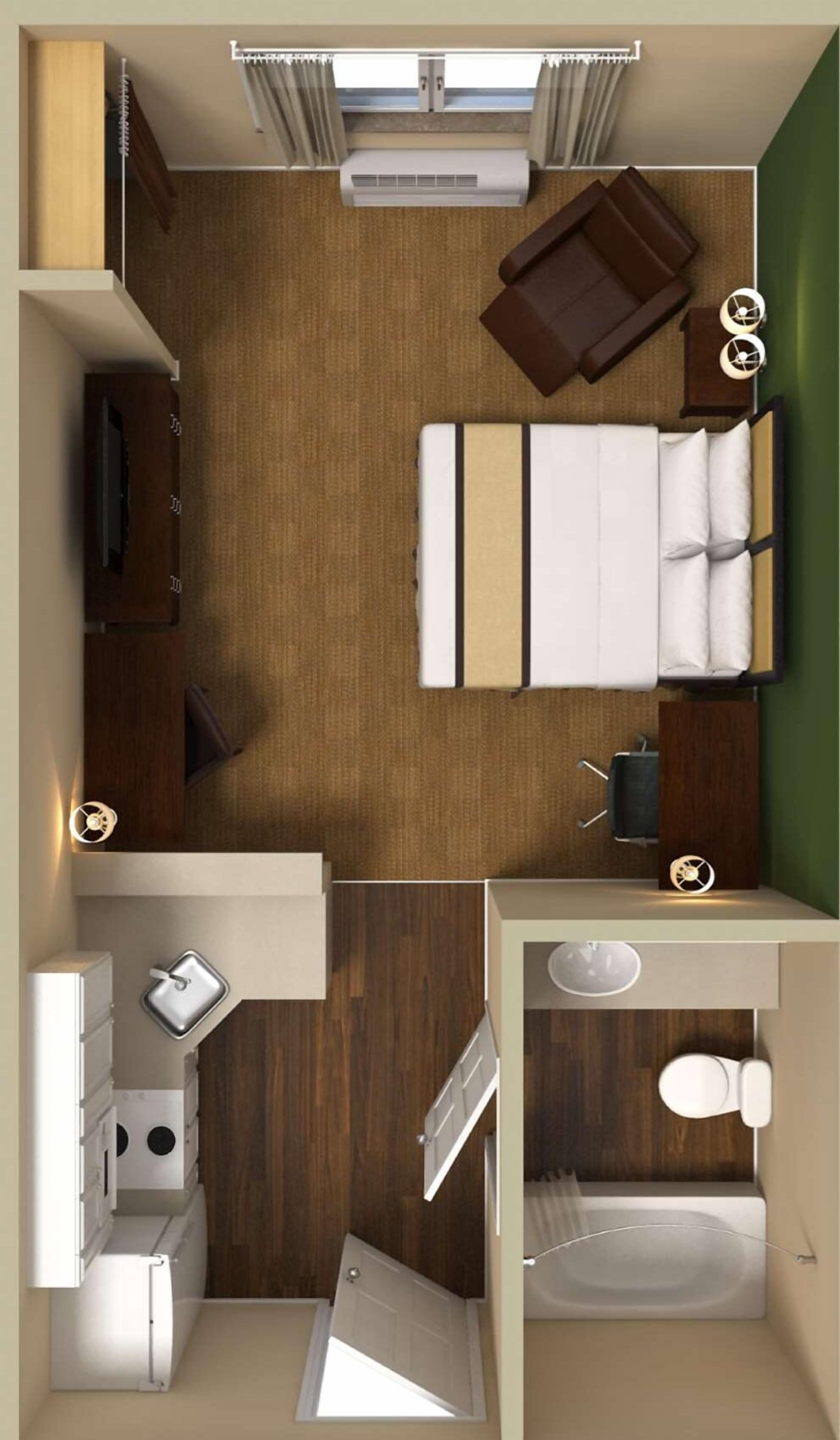 Distribución compacta de una autocaravana con dormitorio, kitchenette y baño.