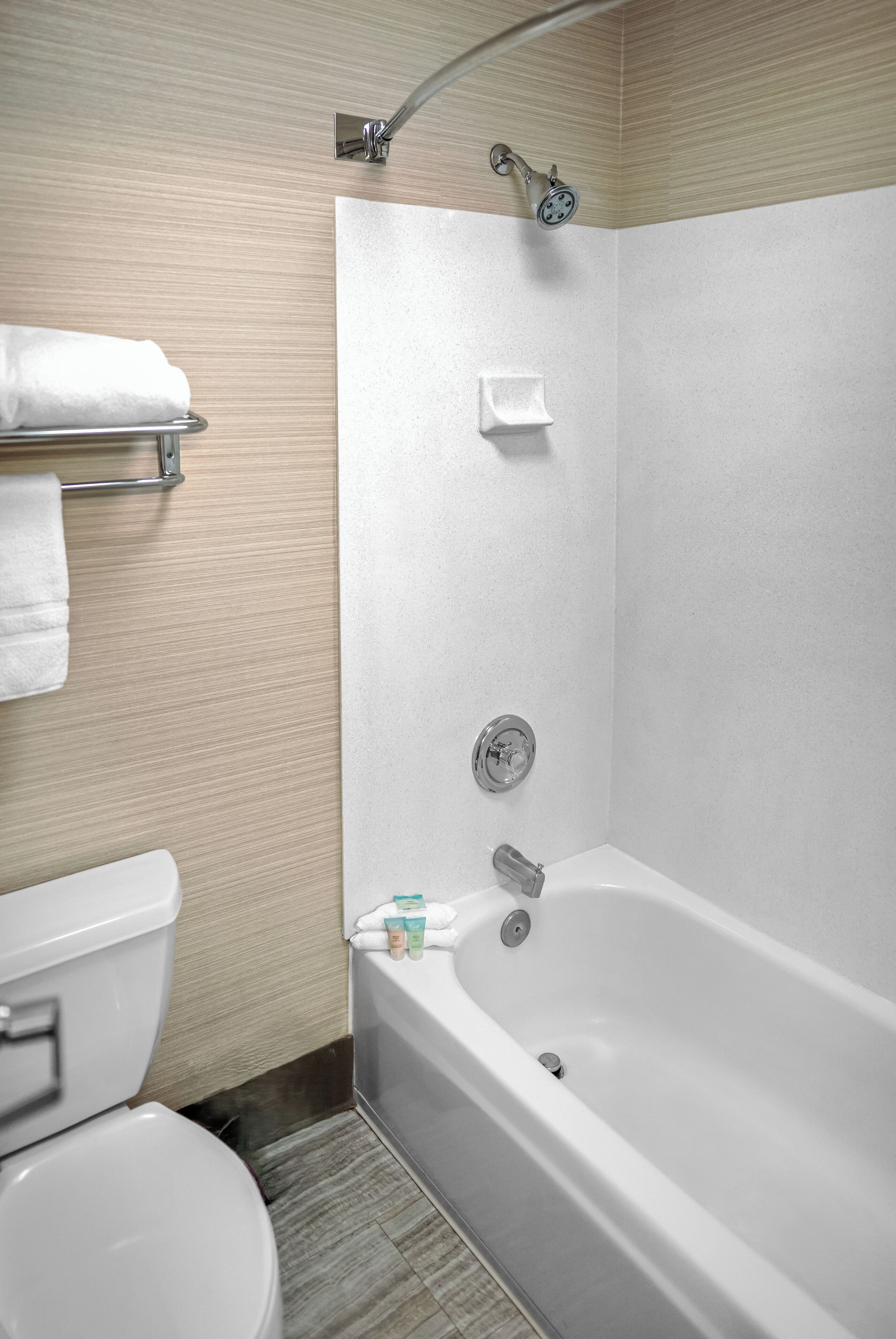 combined shower/bathtub, designer toiletries, hair dryer, towels