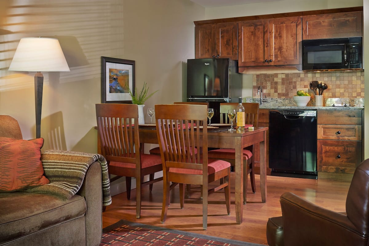 full-sized fridge, microwave, stovetop, dishwasher