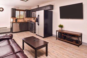 Suite, 1 King Bed, Non Smoking | 1 bedroom, in-room safe, desk, iron/ironing board