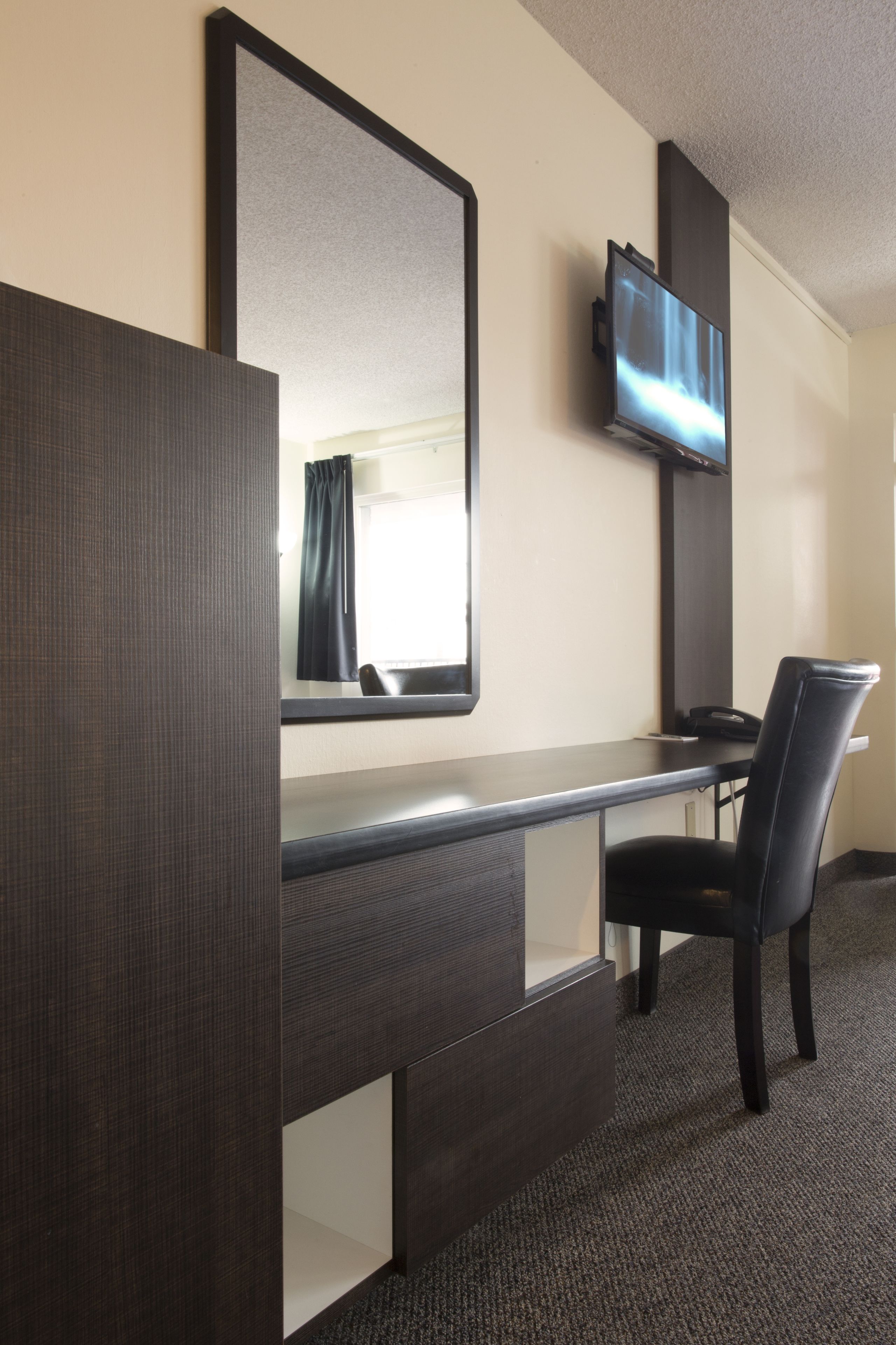 premium bedding, pillow-top beds, desk, laptop workspace