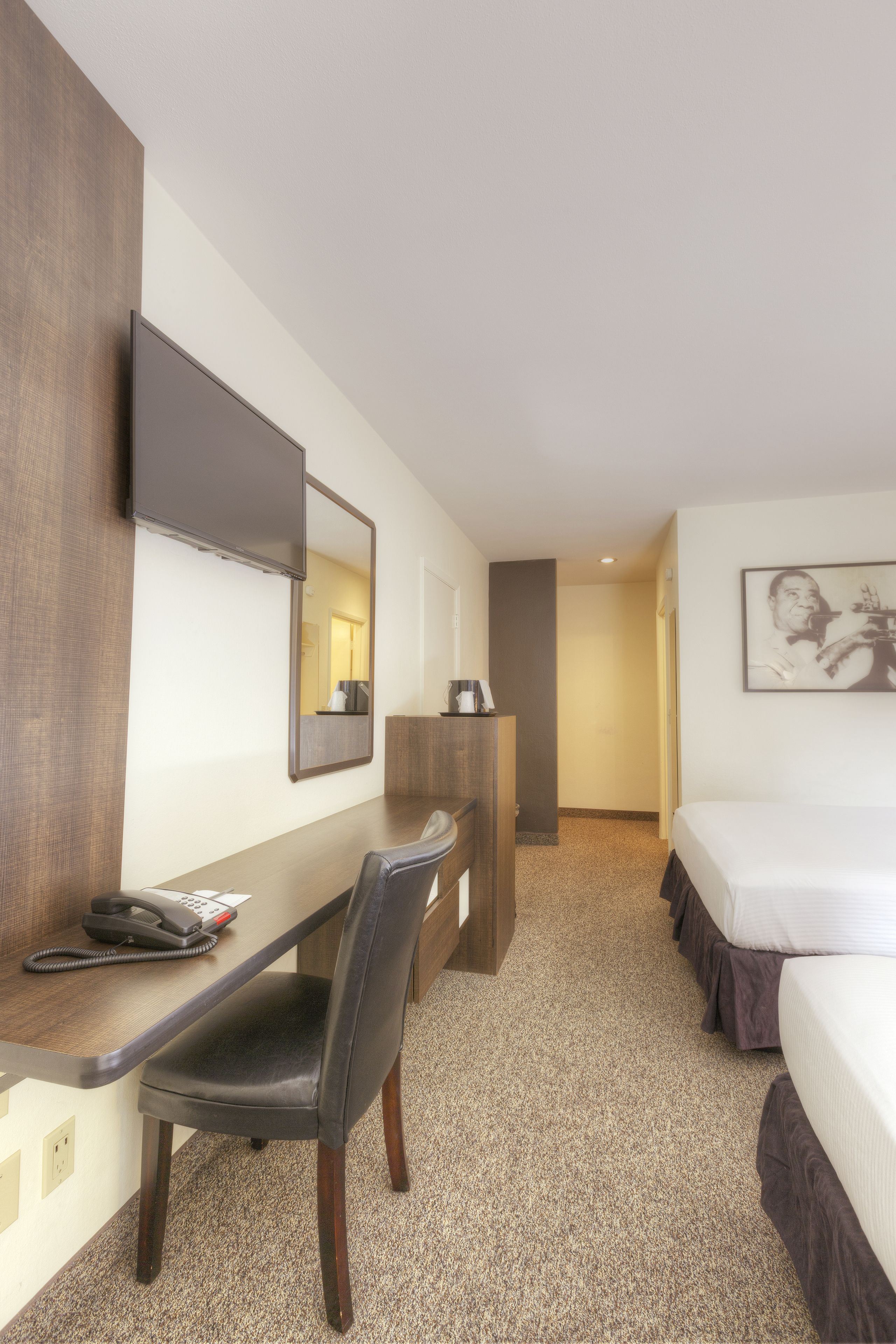 premium bedding, pillow-top beds, desk, laptop workspace