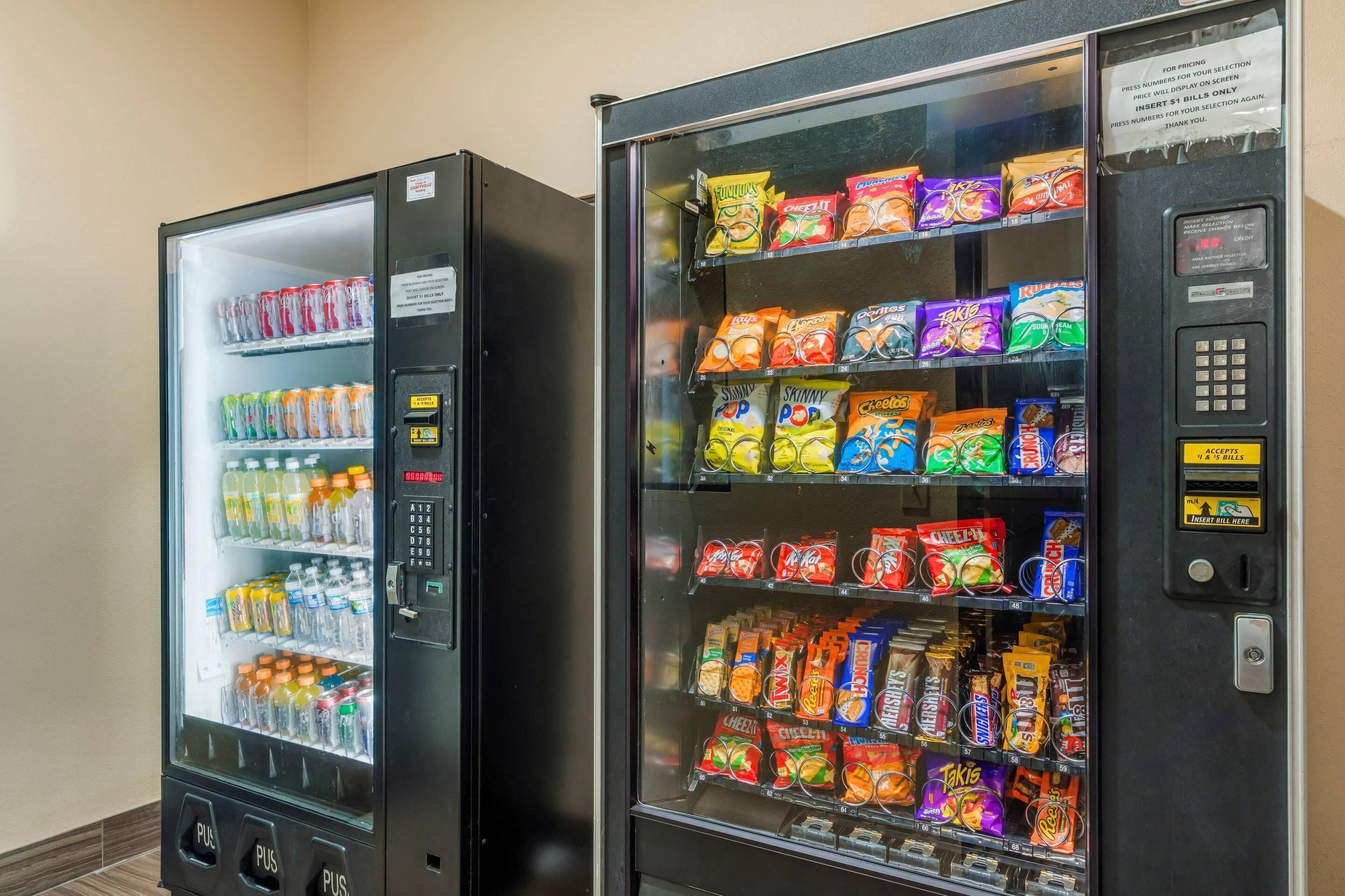 Two vending machines with a variety of snacks and drinks.