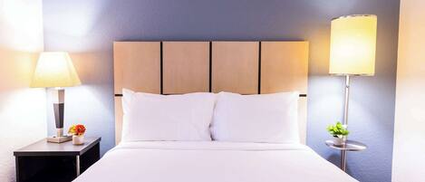 Desk, laptop workspace, blackout drapes, iron/ironing board