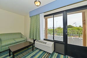 Suite, 1 King Bed, Non Smoking | Living area | 42-inch plasma TV with digital channels, TV