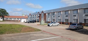 Guest rooms feature a consistent architectural style with brick facades and peaked roofs.