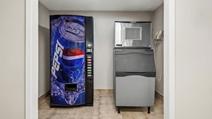 A vending machine with a Pepsi logo and a refrigerator with a Scotman logo. - Red Roof Inn & Suites Euless - DFW Airport Southwest (Euless)