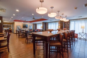 Enjoy meals in this stylish dining area with a large table and comfortable seating.