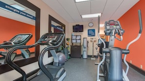 A gym with treadmills, an elliptical, and a stationary bike. - Hampton Inn Bellevue / Nashville-I-40 West (Nashville)