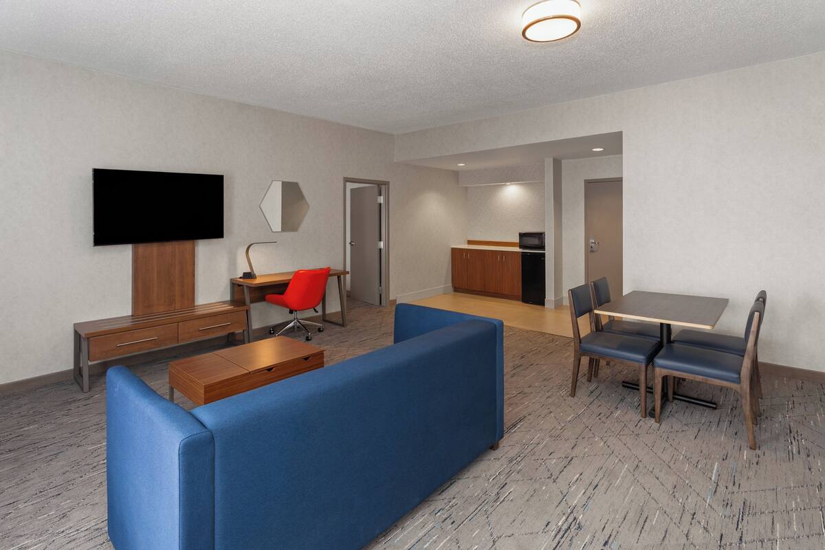 Suite, 1 King Bed, Accessible (Communications) | Premium bedding, in-room safe, desk, iron/ironing board