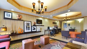 A hotel lobby with a chandelier, seating area, and a reception desk. - Hampton Inn Sturgis-Lagrange Area (Sturgis)