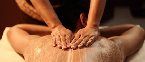 A person receiving a back massage.