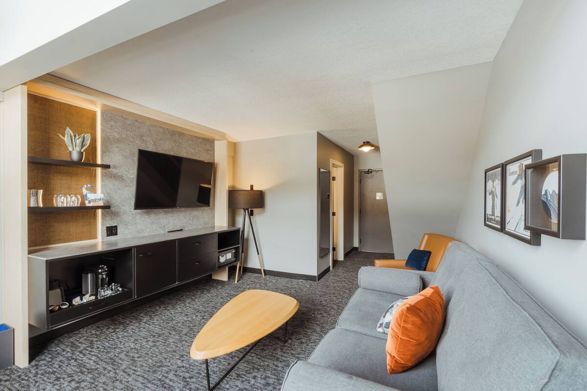 King Loft Suite (No Pets, Spa Not Included) | Living area | 55-inch flat-screen TV with cable channels, TV, pay movies