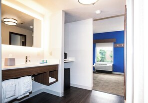 A modern bathroom with a large mirror, a sink, and a toilet. - Holiday Inn Express & Suites Nashville - Brentwood I-65 by IHG (Brentwood)
