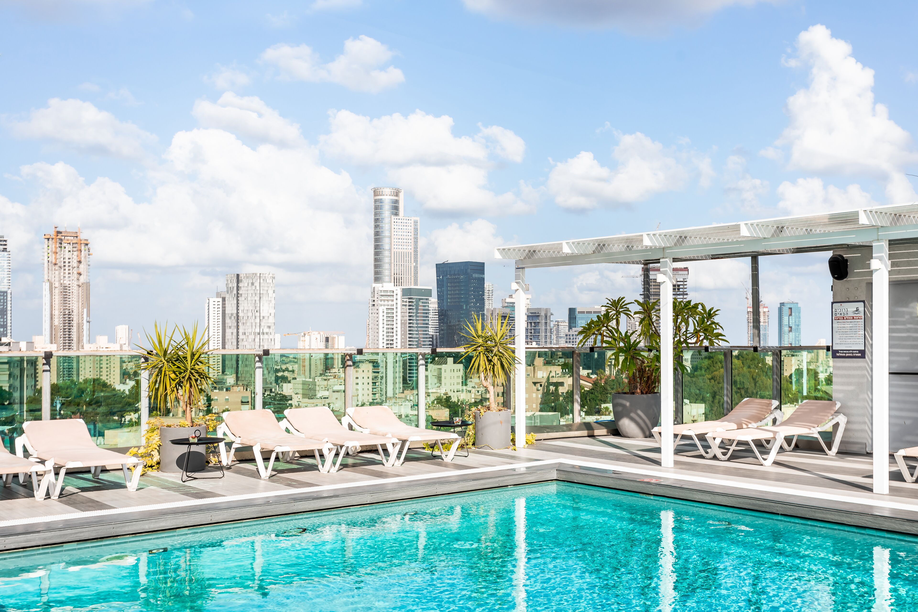 Outdoor pool, open 10:00 AM to 5:00 PM, pool umbrellas, pool loungers