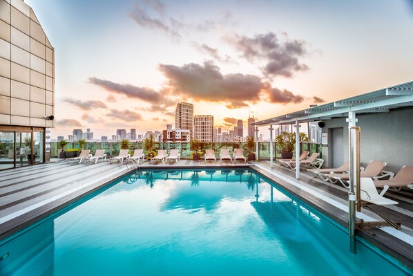Outdoor pool, open 10:00 AM to 5:00 PM, pool umbrellas, sun loungers