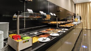 A buffet with various food items and condiments. - Olissippo Marques de Sa (Lisbon)