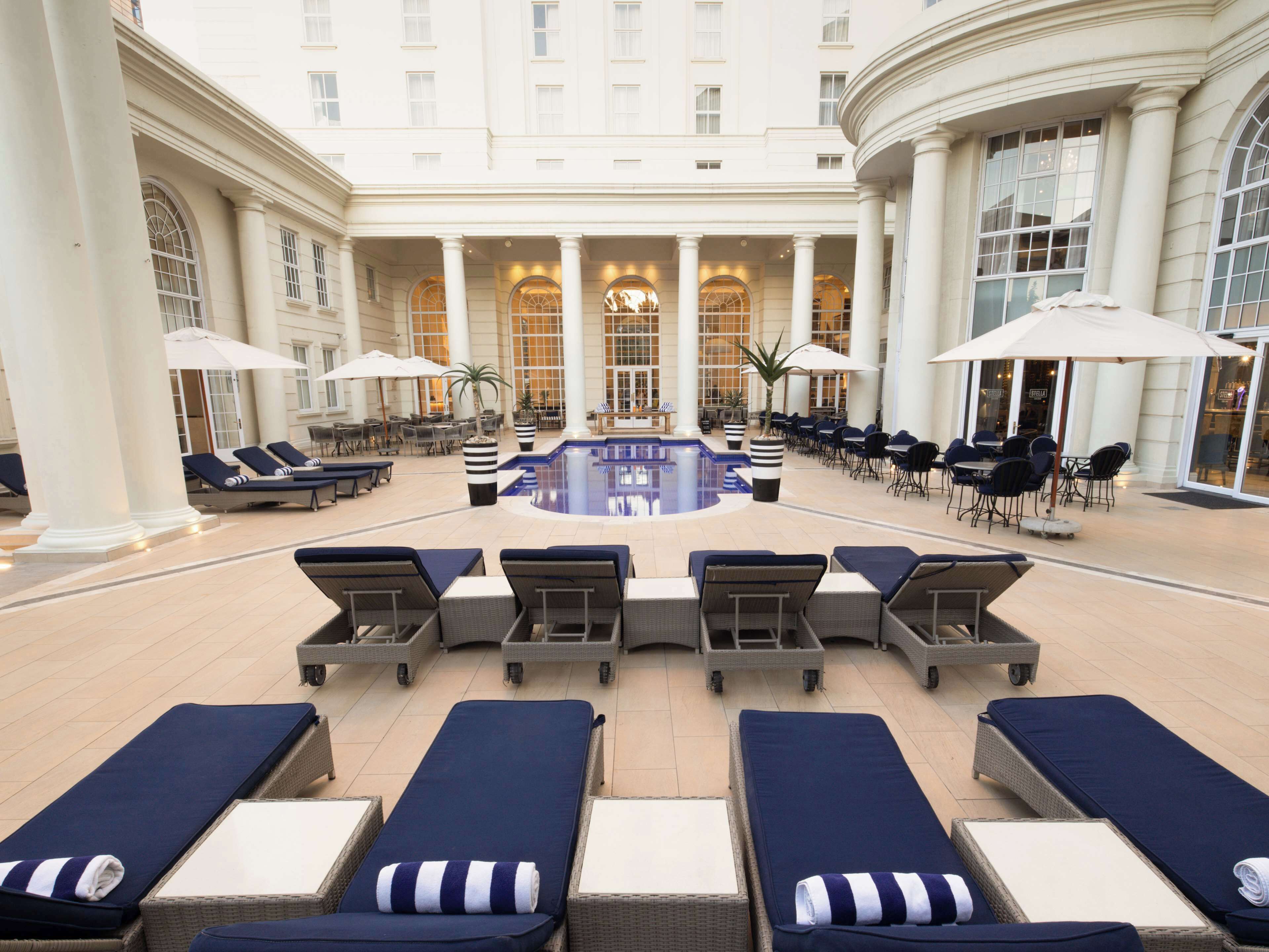 Outdoor pool, open 8:00 AM to 8:00 PM, pool umbrellas, pool loungers