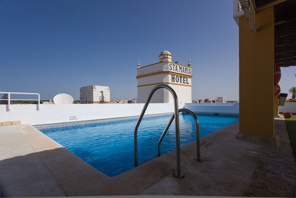 Outdoor pool, open 10:00 AM to 9:00 PM, pool umbrellas, sun loungers