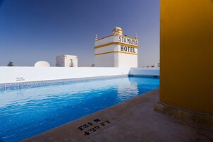 Outdoor pool, open 10:00 AM to 9:00 PM, pool umbrellas, sun loungers