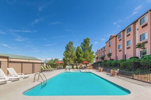 Seasonal outdoor pool, open 9:00 AM to 10:00 PM, pool umbrellas