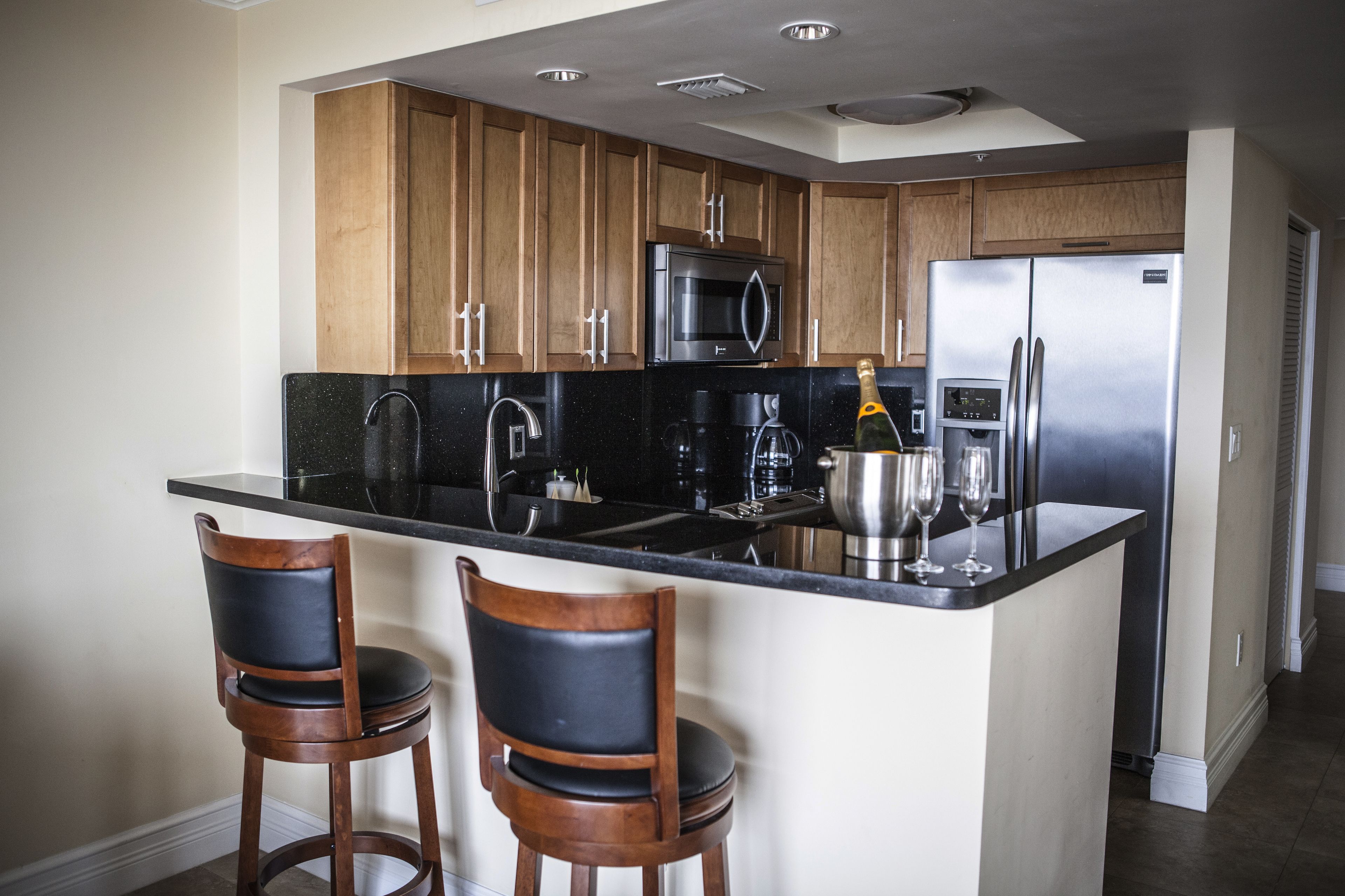 full-sized fridge, microwave, coffee/tea maker, cookware/dishes/utensils