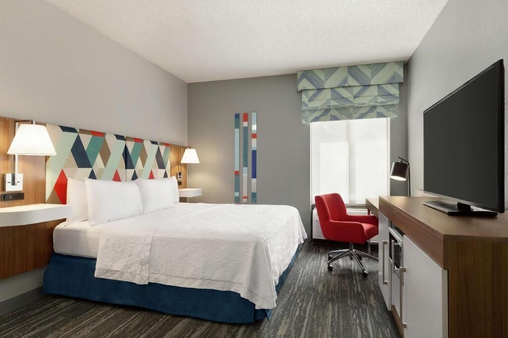 Premium bedding, laptop workspace, blackout curtains, iron/ironing board