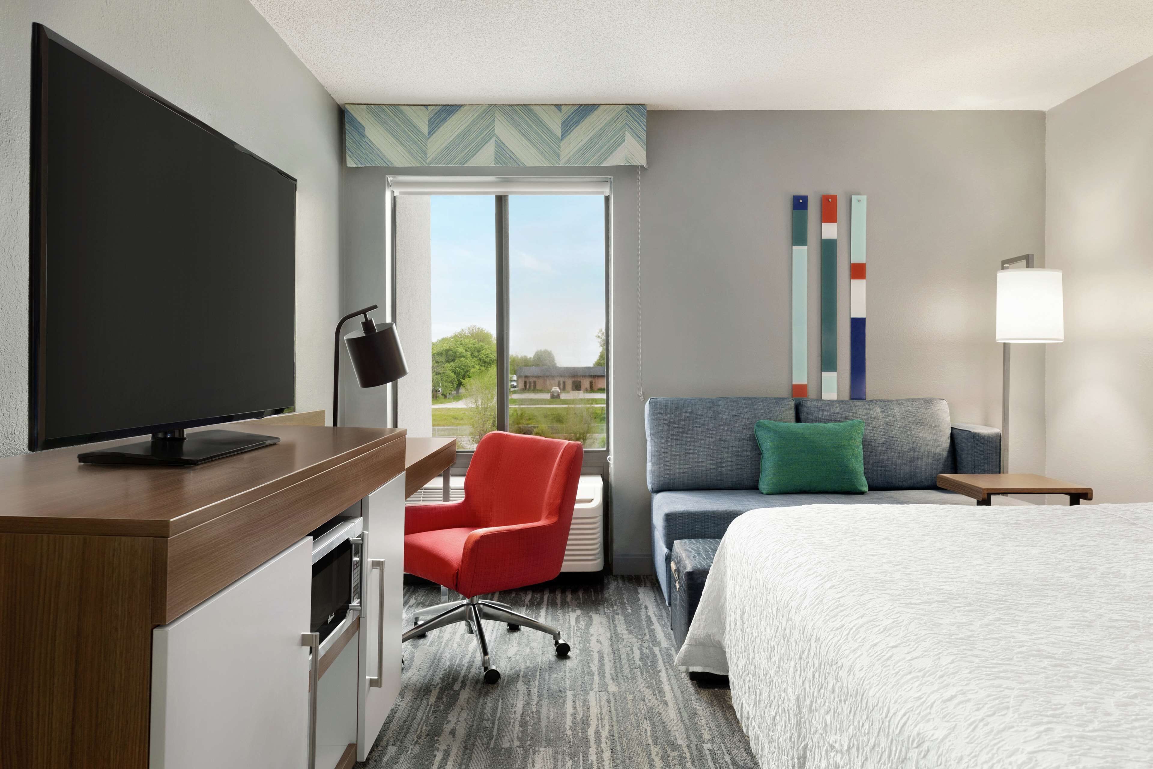 premium bedding, laptop workspace, blackout curtains, iron/ironing board