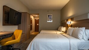 A hotel room with two beds, a desk with a chair, a flat-screen TV, and a wall-mounted light fixture. - Holiday Inn Express Hotel & Suites West Chester by IHG (West Chester)