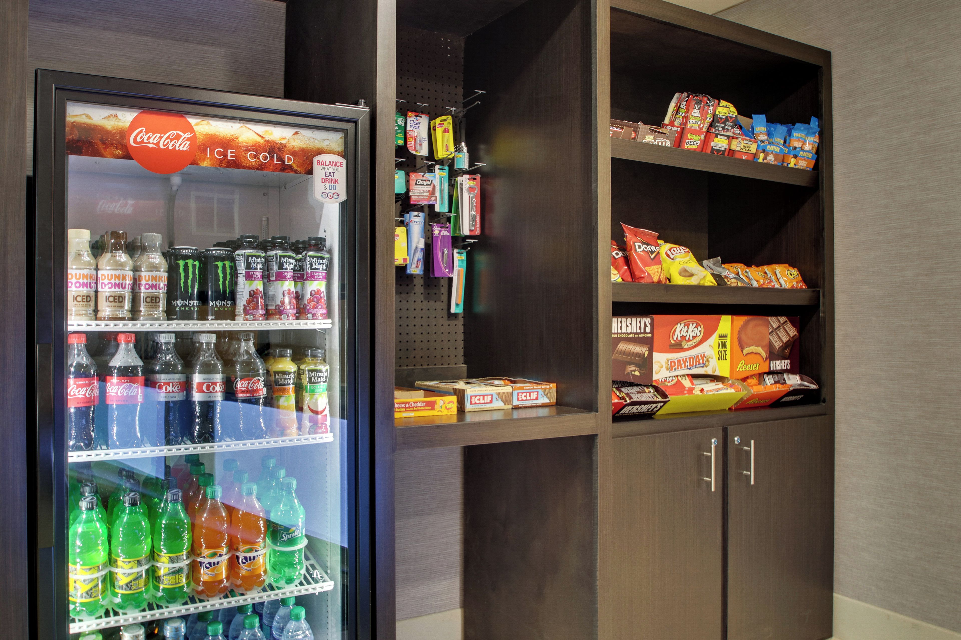 A vending machine stocked with various beverages and snacks.