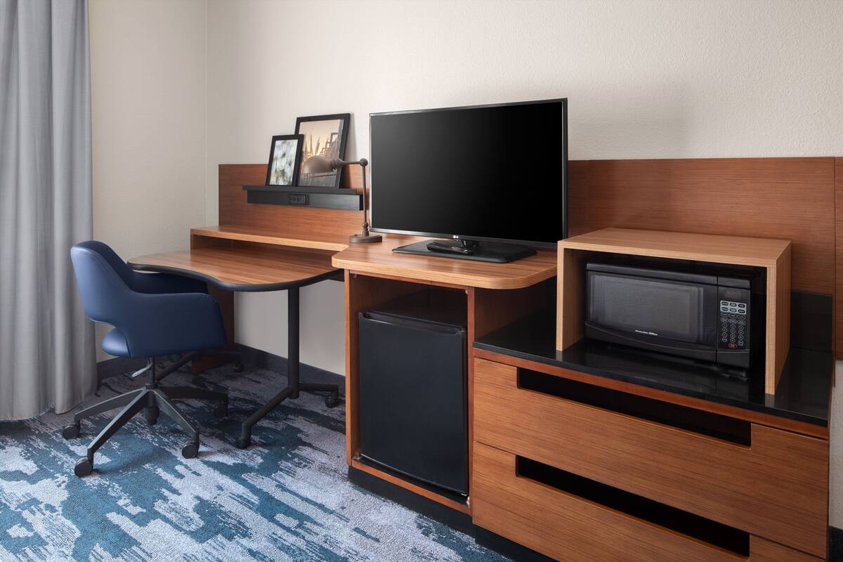 premium bedding, desk, laptop workspace, blackout curtains