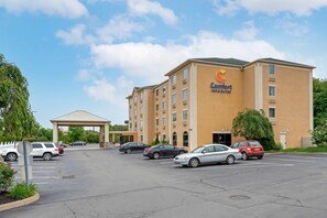 A Comfort Inn hotel with a parking lot and a covered entrance.