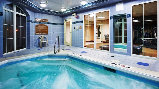 A pool area with a no diving sign, a no smoking sign, and a no smoking please sign. - Holiday Inn Express & Suites Asheville SW - Outlet Ctr Area by IHG (Asheville)