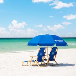 On the beach, white sand, sun loungers, beach umbrellas