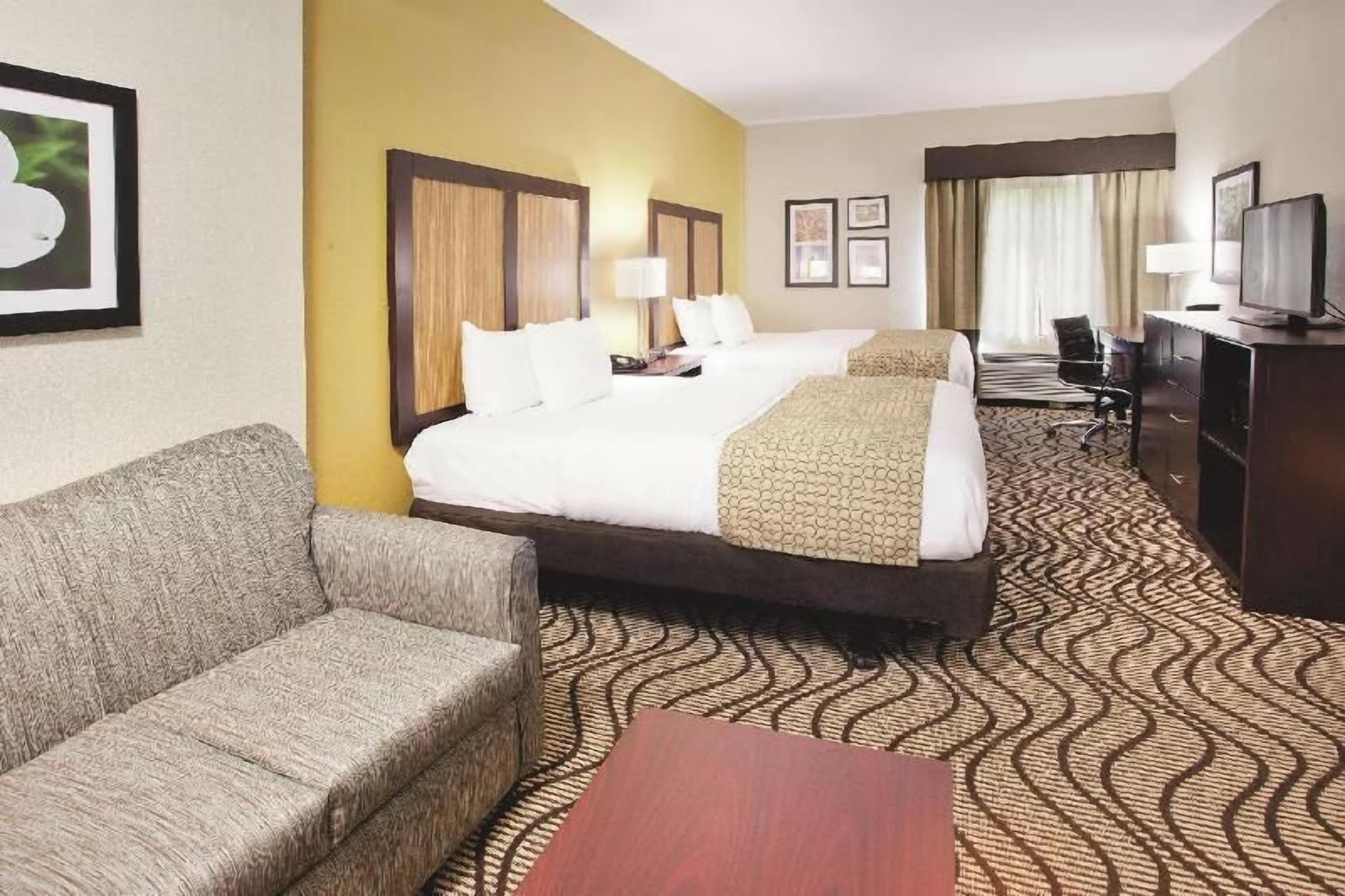 Premium bedding, pillowtop beds, desk, laptop workspace